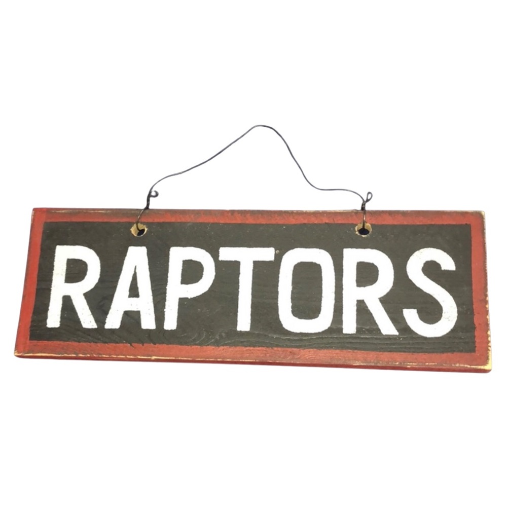 Raptors Wooden Sign by Settler’s Cabin
